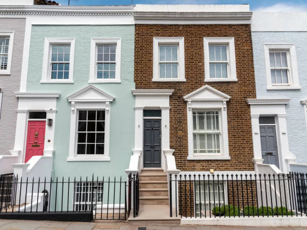 Colourful terraced houses exterior — pebbledash painting in Hampstead by Hampstead Decorators