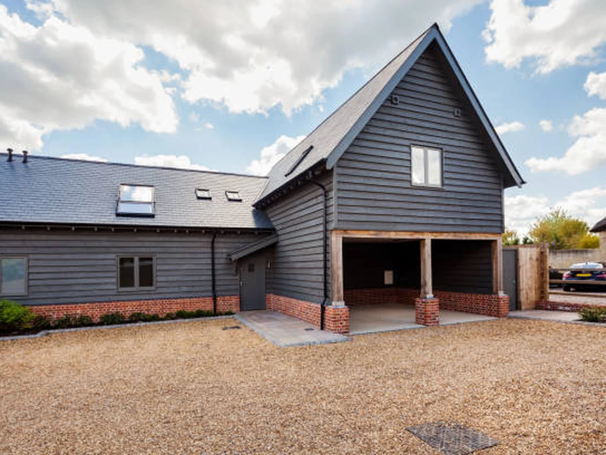 Converted barn-style exterior painted by Hampstead Decorators — exterior and garage door painting NW London