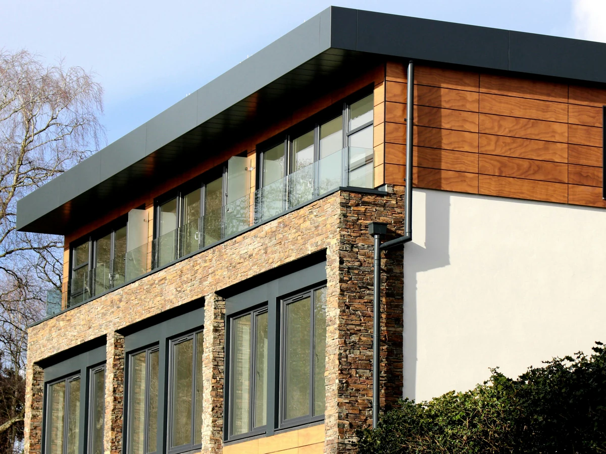 Modern rendered building exterior — pebbledash painting costs Hampstead North London