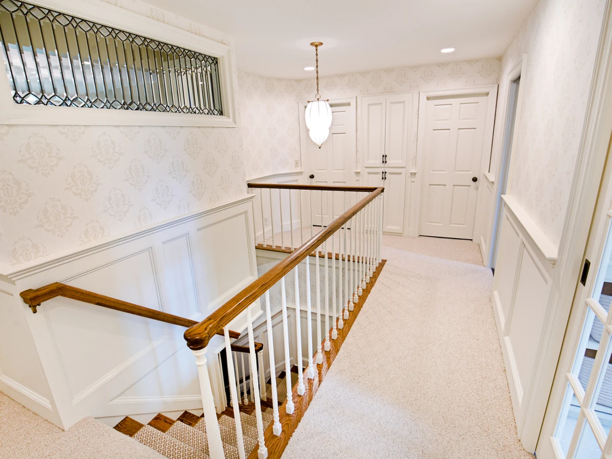 staircase-painting-residential-stairwell-white-hampstead-decorators White residential stairwell painting in Hampstead by Hampstead Decorators