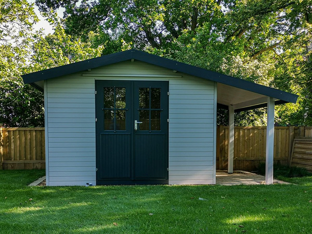 Dark green painted wooden garden structure by Hampstead Decorators